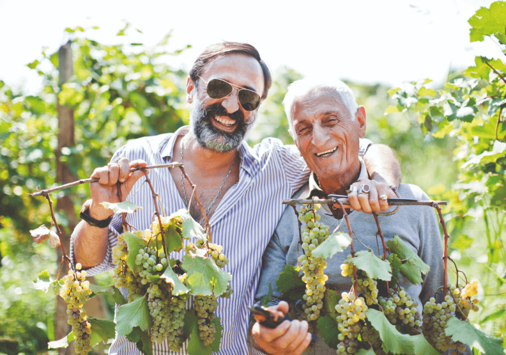 happy men with grapes