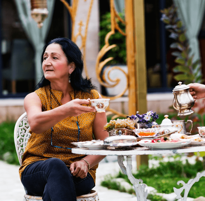 woman having breakfast outside