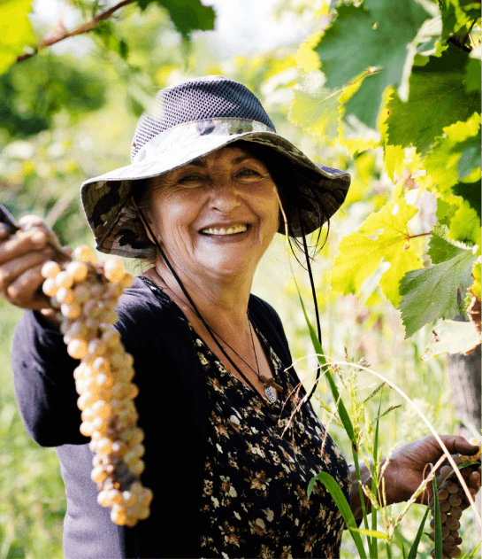 Happy woman with grapes